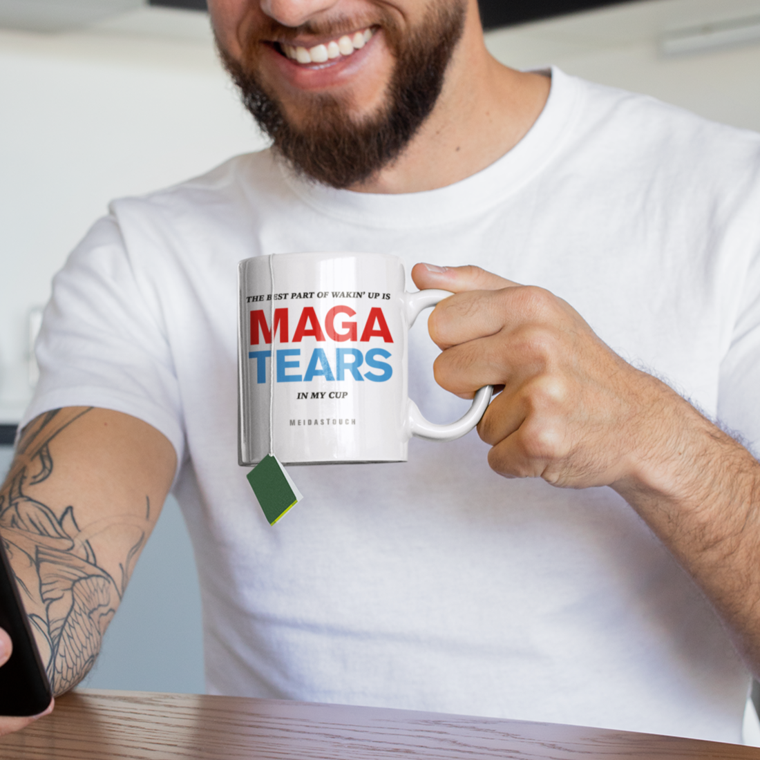 mug-mockup-of-a-tattooed-man-having-some-tea-at-home-24017.png